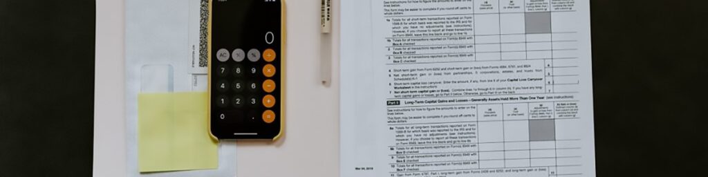 calculator and tax return forms|Calculator and tax return forms of a finance manager